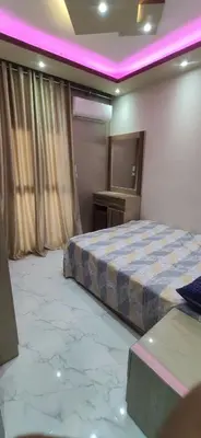 a bedroom with a bed and a television in it at الغردقة شارع مترو in Hurghada