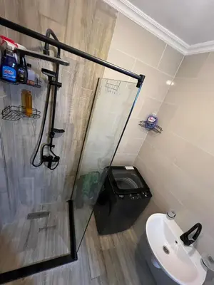 a bathroom with a toilet and a sink at Chic studio at a modern resort in Hurghada
