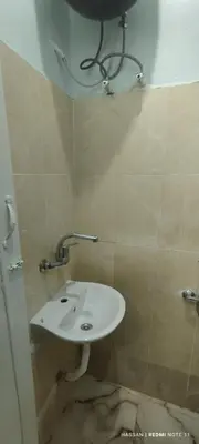 a bathroom with a white sink in a room at the golden house in Luxor