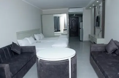 a living room with two couches and a table at Sea view studio in Hurghada