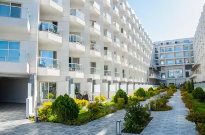 an apartment building with a garden in front of it at Sea view studio in Hurghada