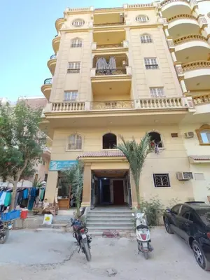 a building with two motorcycles parked in front of it at flat in Hurghada Sheraton Metro street in Hurghada