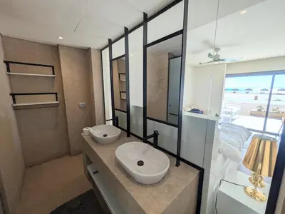 a bathroom with a white sink and a mirror at Beachfront Somabay Cabana Steps From Sea & Pool in Hurghada