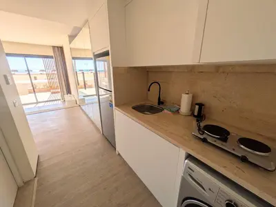 a kitchen with a sink and a counter top at Beachfront Somabay Cabana Steps From Sea & Pool in Hurghada
