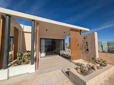 a house on the beach with a view of the ocean at Beachfront Somabay Cabana Steps From Sea & Pool in Hurghada