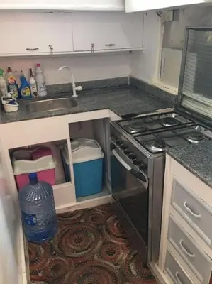 a kitchen with a sink and a stove at ايجبت تورز in Luxor