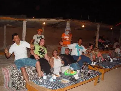 a group of people are posing for a picture at ايجبت تورز in Luxor