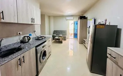 a kitchen with a sink and a refrigerator in it at Zuni in Hurghada