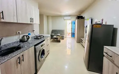 a kitchen with a sink and a refrigerator at Zuni in Hurghada