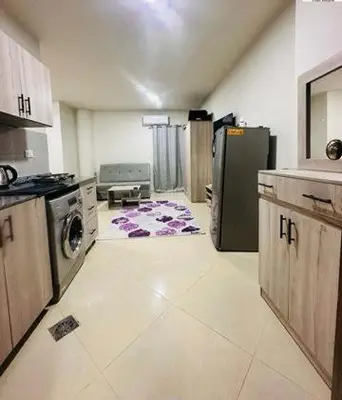 a kitchen with a stove and a refrigerator at Zuni in Hurghada