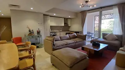 a living room with a couch and a table at Mangroovy Gouna Beach and pool in Hurghada