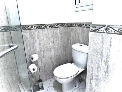 a bathroom with a toilet and a shower at Al Saraya Sahl Hasheesh by Peaks One Bedroom Apartment With Pool View B405&A410 in Hurghada