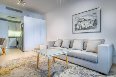 a living room with a couch and a table at Al Saraya Sahl Hasheesh by Peaks One Bedroom Apartment With Pool View B405&A410 in Hurghada