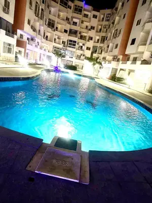 a large swimming pool in the middle of a building at Your city hotel in a private location! in Hurghada