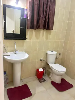 a bathroom with a sink and a toilet and a mirror at Your city hotel in a private location! in Hurghada