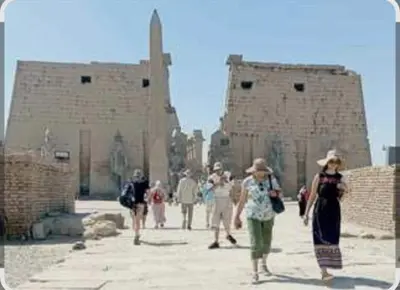 a group of people walking in front of a building at Elbess For Tourism in Jazīrat al ‘Awwāmīyah