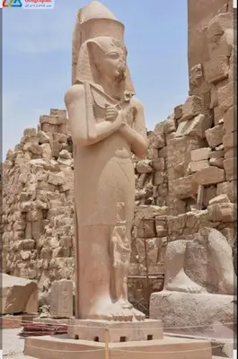 a statue of a woman standing in front of a building at Elbess For Tourism in Jazīrat al ‘Awwāmīyah