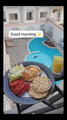 a plate of food with biscuits and vegetables on a table at Sheraton Plaza Hurghada in Hurghada