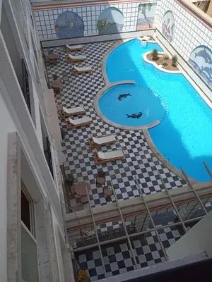 an overhead view of a swimming pool in a building at Sheraton Plaza Hurghada in Hurghada