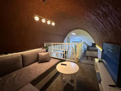 a living room with a couch and a table at Luxury cozy apartment in Hurghada