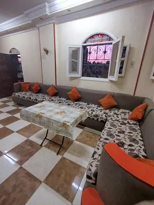 a living room with a couch and a table at Luna Nile in Aswan