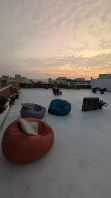 three bean bags sitting on top of a roof at Hostify Hostel and Rooftop in Hurghada