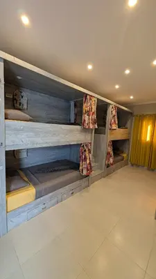 a room with two bunk beds in a room at Hostify Hostel and Rooftop in Hurghada
