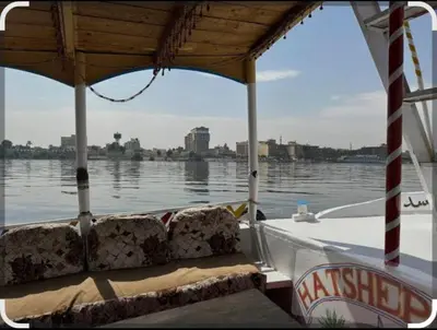 a boat on a body of water at Elbess For Tourism in Al Karnak