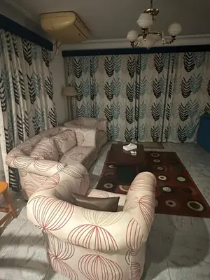 a living room with two couches and a coffee table at Paradise Villa in Hurghada