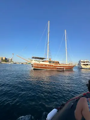 a boat sitting in the water next to a boat at Paradise Villa in Hurghada