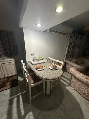 a dining room table with plates of food on it at Paradise Villa in Hurghada