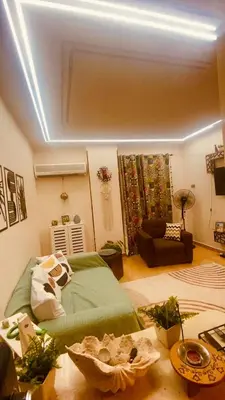 a living room with a bed and a couch at Chill & Cozy Stay in Hurghada