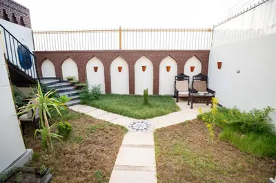 a courtyard of a building with a patio at The Village House with Private Garden - Four Bedroom Nubian Home on Luxor West Bank in Luxor