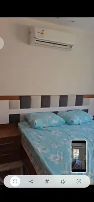 a picture of a bed with a cell phone on it at Hurghada Hub in Hurghada
