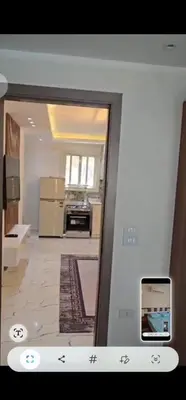 a view of a kitchen through a glass door at Hurghada Hub in Hurghada