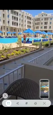 a picture of a view of a pool with a cell phone at Hurghada Hub in Hurghada