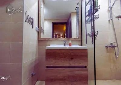 a bathroom with a sink and a mirror at Luxury Rooftop Penthouse Sea View & Pools in Hurghada