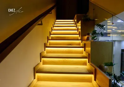 a set of stairs in a building with lights at Luxury Rooftop Penthouse Sea View & Pools in Hurghada
