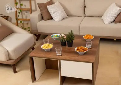 a living room with a table with bowls of food on it at Mangroovy Retreat Smart home in Hurghada