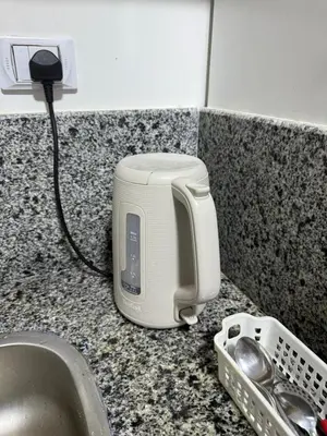 a toaster sitting on a counter next to a sink at جوليانا الغردقة juliana beach D410 in Hurghada