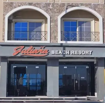 a beach resort sign on the front of a building at جوليانا الغردقة juliana beach D410 in Hurghada