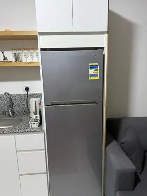 a refrigerator in a kitchen next to a sink at جوليانا الغردقة juliana beach D410 in Hurghada