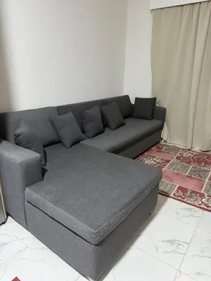 a gray couch in a living room with at جوليانا الغردقة juliana beach D410 in Hurghada