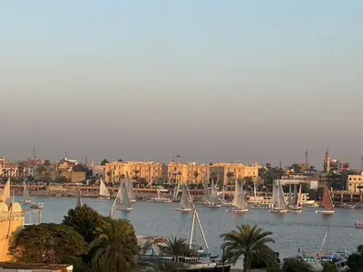 a group of sail boats in a harbor with buildings at Nile Spirit Apt 2 in Jazīrat al ‘Awwāmīyah