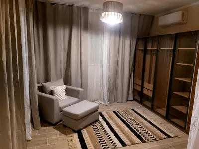 a living room with a couch and a chair at Bay view in Hurghada