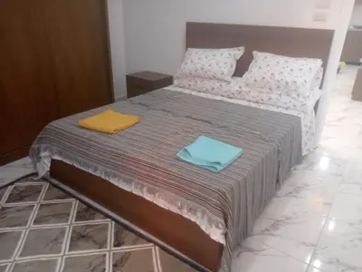 a bed with two towels sitting on top of it at Apartment almina3 in Hurghada