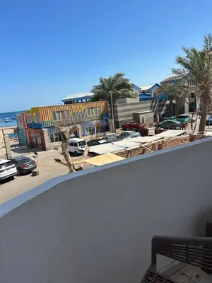 a balcony with a view of the beach and buildings at Apartment almina3 in Hurghada