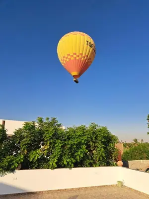 a hot air balloon flying in the sky at Christine Home in Luxor