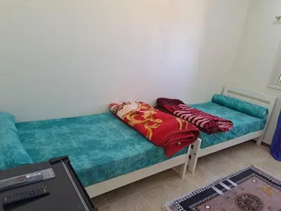 a couch with pillows on it in a room at Sweet Home 8 in Hurghada