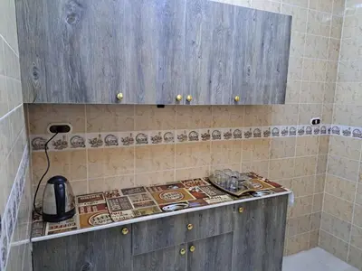 a bathroom with a counter top in a room at Sweet Home 7 in Hurghada